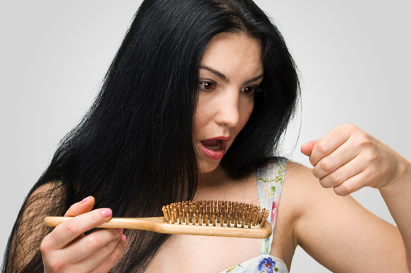 woman suffering from hair loss
